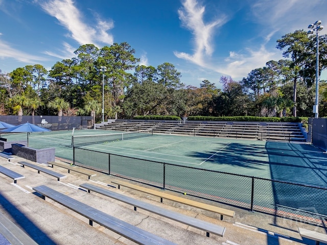 3 Riding Ln, Savannah, GA 31411 - view of tennis court with fence and view of wooded area