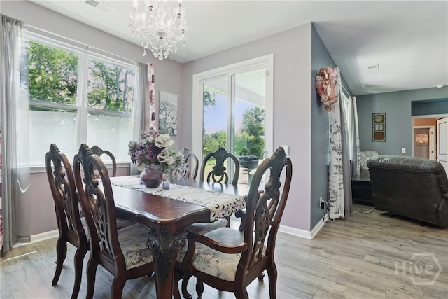 203 Merganser Dr, Pooler, GA 31322 - dining space featuring baseboards, light wood finished floors, and a chandelier