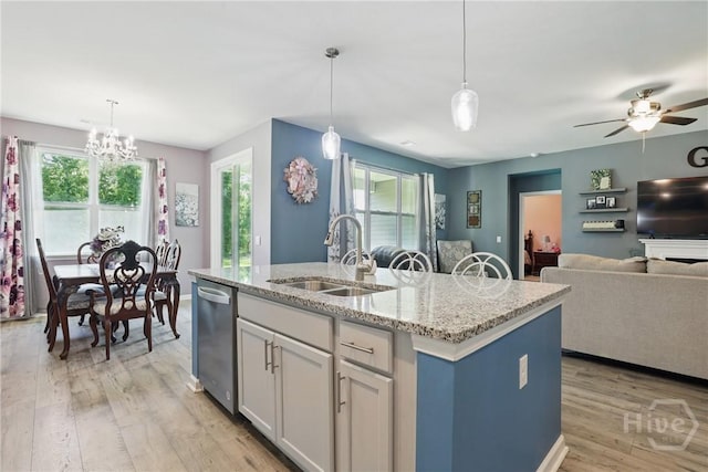 203 Merganser Dr, Pooler, GA 31322 - kitchen with a sink, dishwasher, open floor plan, light wood-style flooring, and an island with sink
