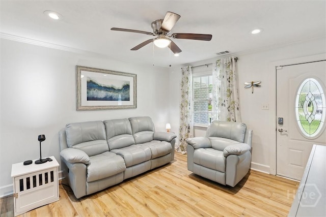 5633 Lafitte Dr, Savannah, GA 31406 - living room featuring light wood-type flooring, ceiling fan, ornamental molding, recessed lighting, and baseboards