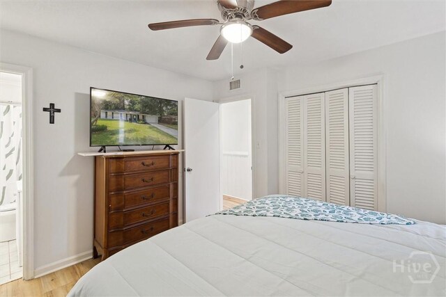 5633 Lafitte Dr, Savannah, GA 31406 - bedroom featuring light wood-type flooring, a closet, a ceiling fan, and baseboards