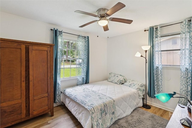 5633 Lafitte Dr, Savannah, GA 31406 - bedroom with light wood-style flooring and a ceiling fan