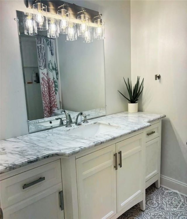 5633 Lafitte Dr, Savannah, GA 31406 - full bath with vanity, a chandelier, baseboards, and tile patterned floors