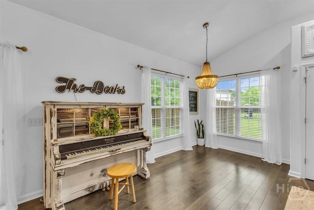 living area with lofted ceiling, dark wood-style flooring, and baseboards