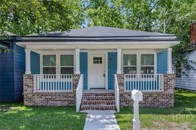 17 Nelson St, Savannah, GA 31415 - bungalow with a porch, brick siding, and roof with shingles
