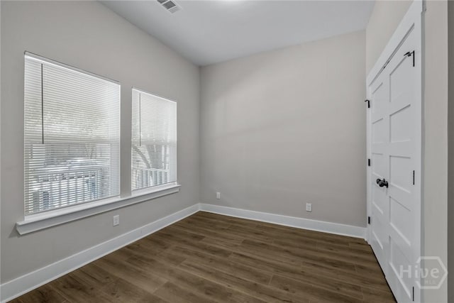 17 Nelson St, Savannah, GA 31415 - empty room featuring dark wood finished floors and baseboards