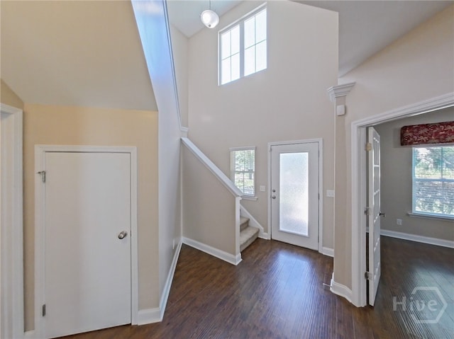 225 James Dunham Pkwy, Richmond Hill, GA 31324 - foyer with dark wood-style floors, stairs, and baseboards