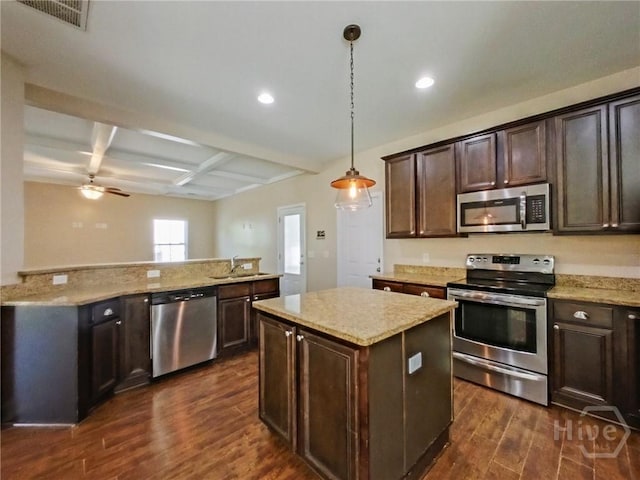 225 James Dunham Pkwy, Richmond Hill, GA 31324 - kitchen featuring stainless steel appliances, dark wood-style floors, a kitchen island, coffered ceiling, and recessed lighting