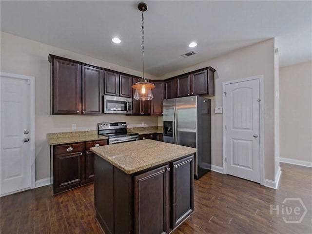 225 James Dunham Pkwy, Richmond Hill, GA 31324 - kitchen featuring appliances with stainless steel finishes, baseboards, dark brown cabinetry, and recessed lighting
