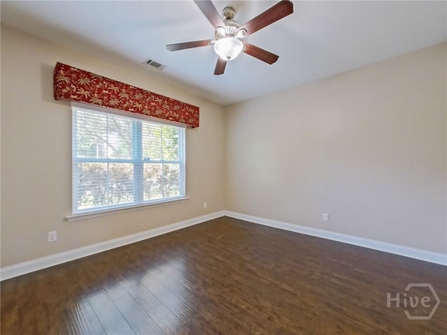225 James Dunham Pkwy, Richmond Hill, GA 31324 - unfurnished room with dark wood-style flooring, ceiling fan, and baseboards