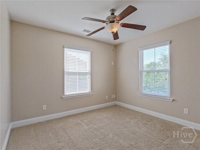 225 James Dunham Pkwy, Richmond Hill, GA 31324 - spare room featuring baseboards, carpet, and a ceiling fan