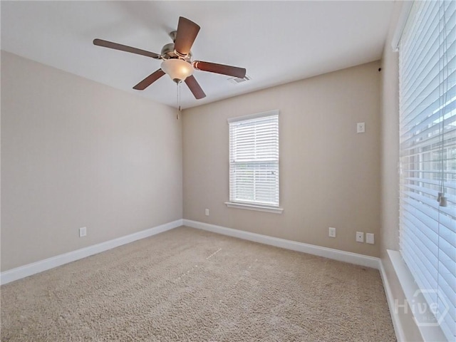 225 James Dunham Pkwy, Richmond Hill, GA 31324 - spare room featuring ceiling fan, light colored carpet, and baseboards