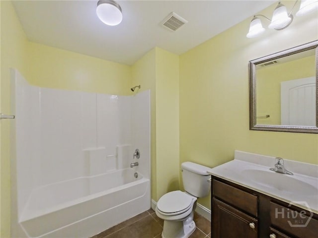 225 James Dunham Pkwy, Richmond Hill, GA 31324 - full bath with tile patterned flooring, toilet, vanity, shower / bath combination, and baseboards