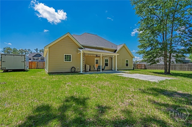 rear view of house featuring a patio area and ceiling fan