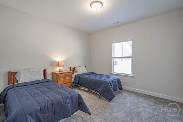 carpeted bedroom with baseboards