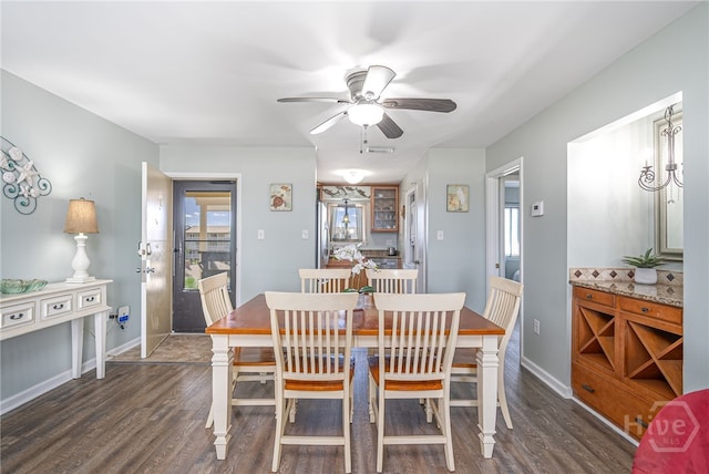 85 Van Horne Ave Unit 25C, Tybee Island, GA 31328 - dining room featuring dark wood-style flooring, ceiling fan, and baseboards