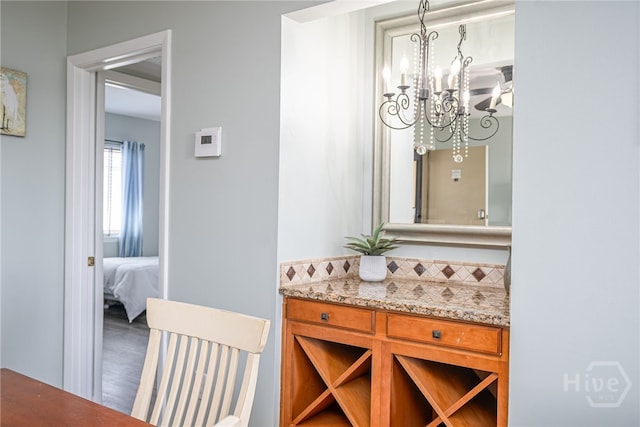 85 Van Horne Ave Unit 25C, Tybee Island, GA 31328 - bathroom featuring a chandelier and vanity
