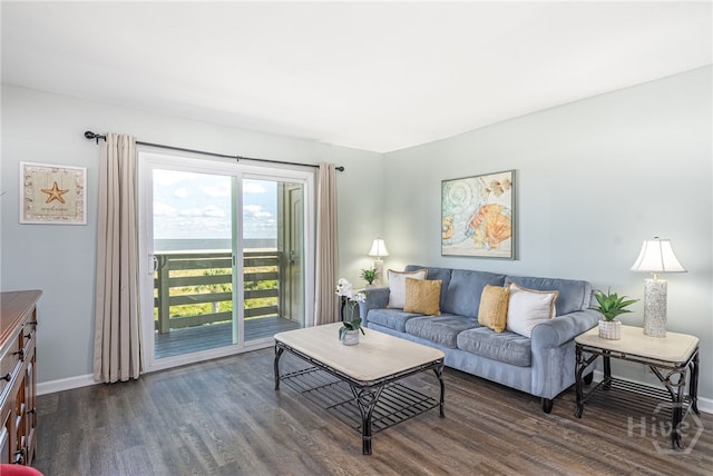 85 Van Horne Ave Unit 25C, Tybee Island, GA 31328 - living area featuring dark wood finished floors and baseboards