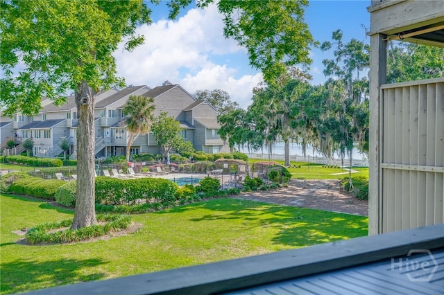 3005 River Dr Unit 209B, Savannah, GA 31404 - view of green lawn featuring a residential view