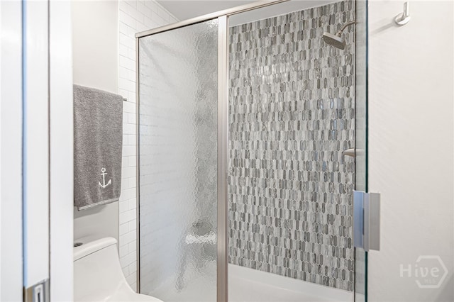 3005 River Dr Unit 209B, Savannah, GA 31404 - bathroom with a shower stall and toilet