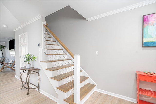 3005 River Dr Unit 209B, Savannah, GA 31404 - stairs featuring crown molding, wood finished floors, and baseboards