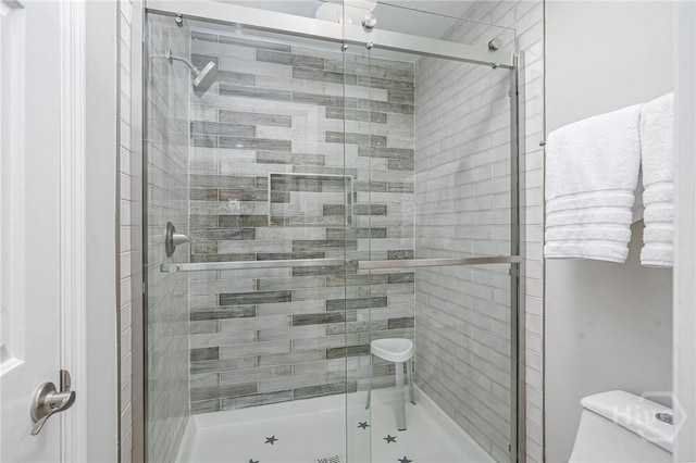 3005 River Dr Unit 209B, Savannah, GA 31404 - bathroom featuring toilet and a stall shower