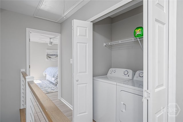 3005 River Dr Unit 209B, Savannah, GA 31404 - laundry room with washer and clothes dryer and light wood-style flooring