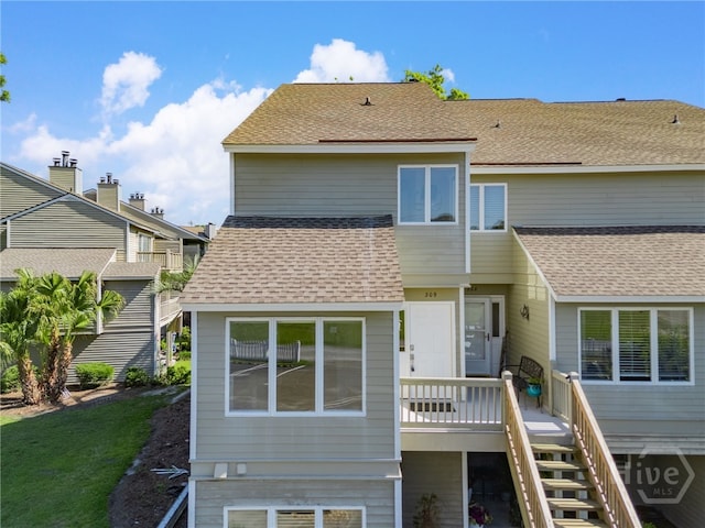 3005 River Dr Unit 209B, Savannah, GA 31404 - rear view of property with stairs, roof with shingles, and a wooden deck