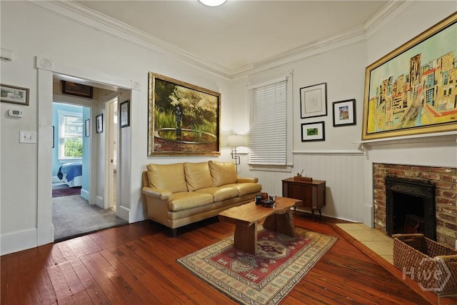 542 E Gaston St Unit A, Savannah, GA 31401 - living room with wood-type flooring, a fireplace, a wainscoted wall, and ornamental molding
