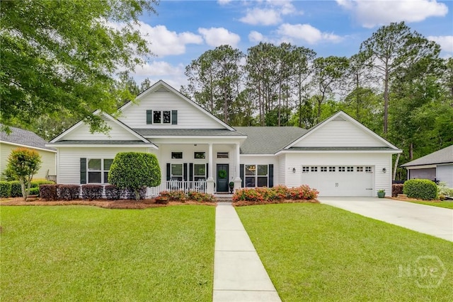 view of front facade featuring a porch, a garage, concrete driveway, and a front yard