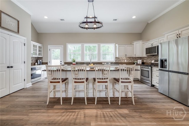 305 Windsor Rd, Guyton, GA 31312 - kitchen featuring stainless steel appliances, tasteful backsplash, white cabinets, crown molding, and recessed lighting
