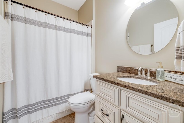 bathroom with toilet, vanity, tile patterned floors, and curtained shower