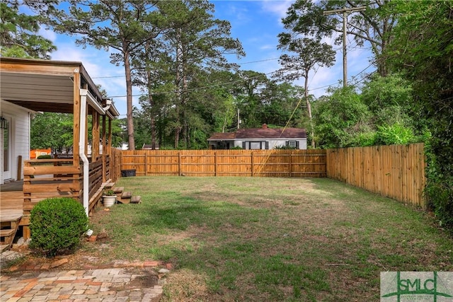 view of yard with a deck