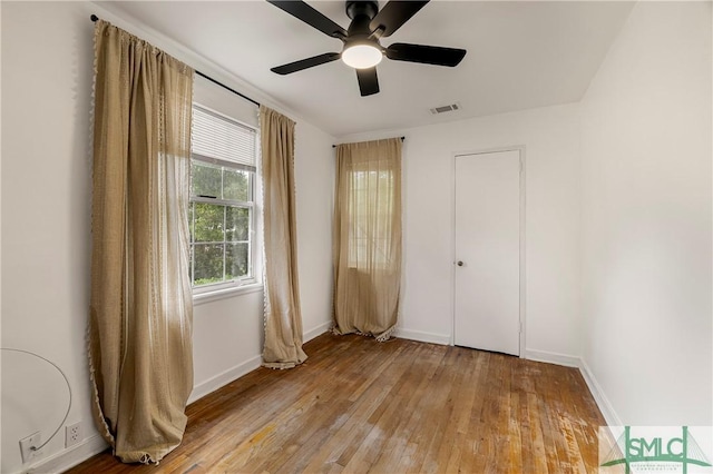 unfurnished bedroom with light wood-style floors, baseboards, and ceiling fan