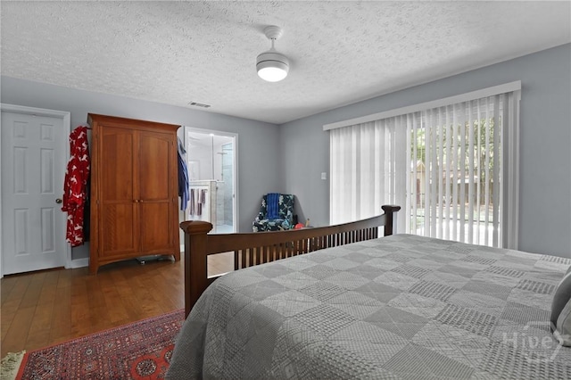 6 Ramsgate Rd, Savannah, GA 31419 - bedroom featuring wood finished floors, a textured ceiling, and access to exterior