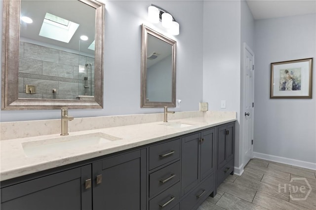 6 Ramsgate Rd, Savannah, GA 31419 - bathroom featuring a skylight, a tile shower, double vanity, and baseboards