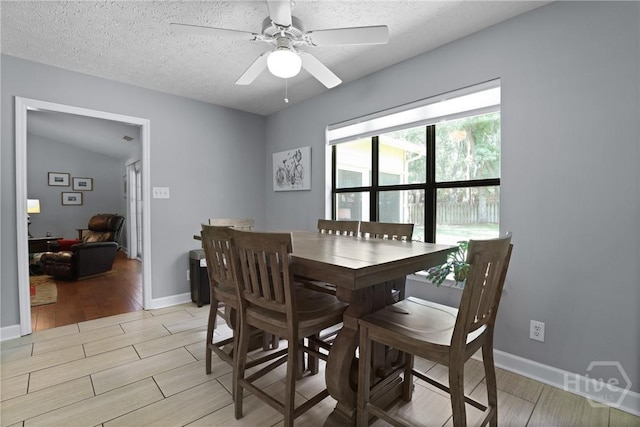 6 Ramsgate Rd, Savannah, GA 31419 - dining space featuring light wood-style floors, a ceiling fan, a textured ceiling, and baseboards