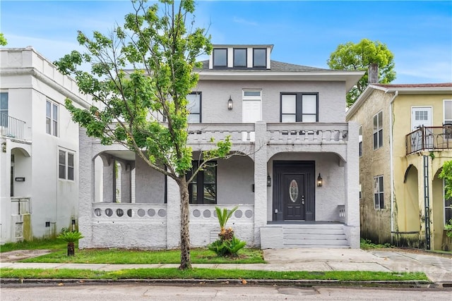 523 E 39th St, Savannah, GA 31401 - view of front of house featuring covered porch, a balcony, and stucco siding