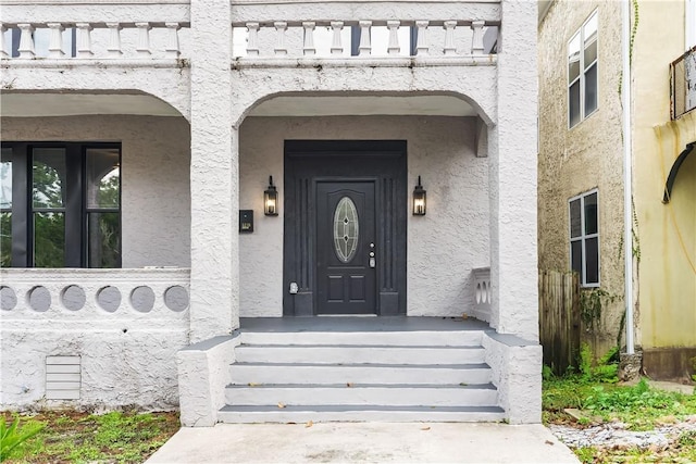 523 E 39th St, Savannah, GA 31401 - doorway to property featuring stucco siding and a porch