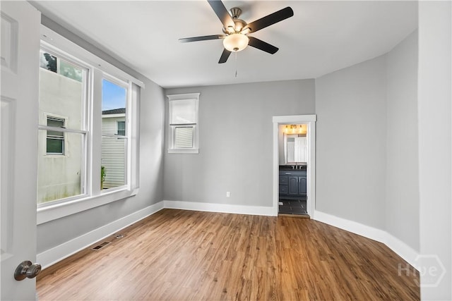 523 E 39th St, Savannah, GA 31401 - unfurnished room featuring wood finished floors, baseboards, and a ceiling fan