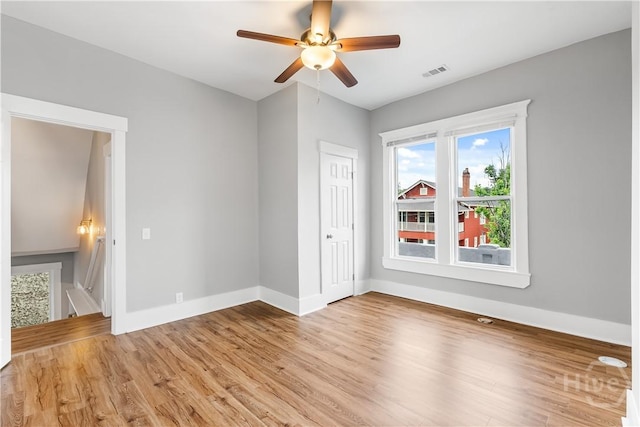 523 E 39th St, Savannah, GA 31401 - empty room with light wood-style flooring, baseboards, and ceiling fan