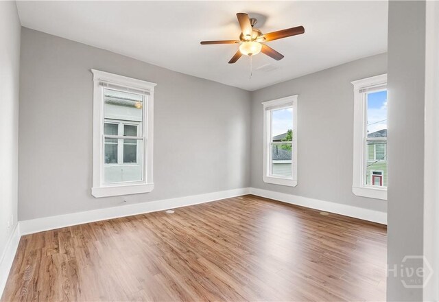 523 E 39th St, Savannah, GA 31401 - unfurnished room featuring wood finished floors, baseboards, and a ceiling fan