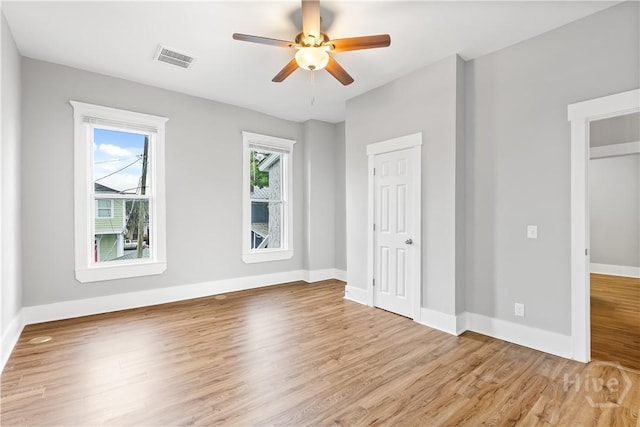 523 E 39th St, Savannah, GA 31401 - unfurnished bedroom with wood finished floors, baseboards, and ceiling fan