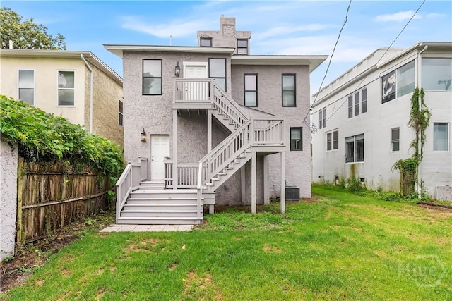 523 E 39th St, Savannah, GA 31401 - rear view of property with stairway, stucco siding, and central air condition unit