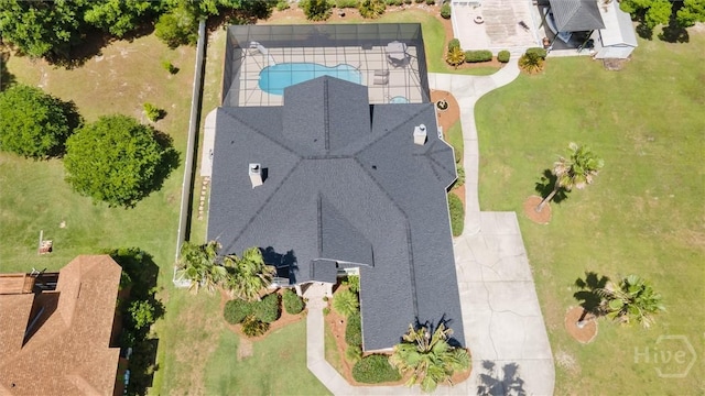 aerial view of property and surrounding area with a pool area