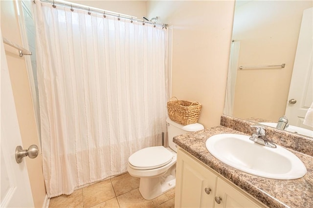 full bathroom with toilet, vanity, curtained shower, and tile patterned floors