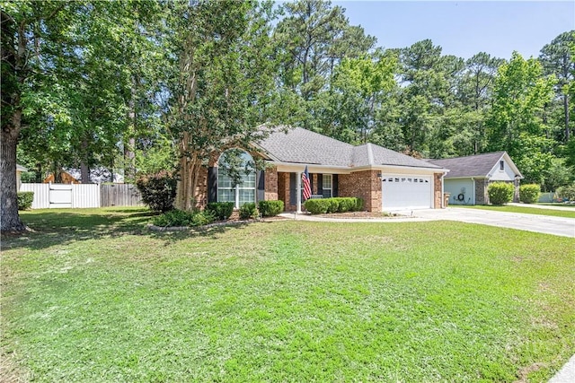 view of front of house featuring driveway, brick siding, and a garage