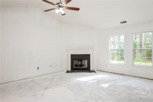 5 Hamilton Grove Dr, Pooler, GA 31322 - unfurnished living room featuring a fireplace with raised hearth, unfinished concrete floors, vaulted ceiling, and a ceiling fan