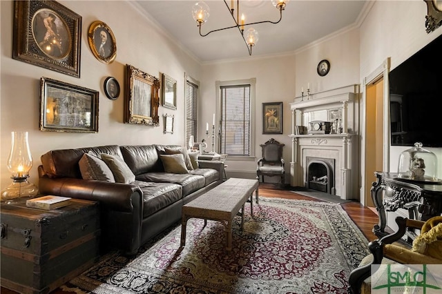 102 E 38th St, Savannah, GA 31401 - living room featuring wood finished floors, a chandelier, crown molding, and a fireplace with flush hearth
