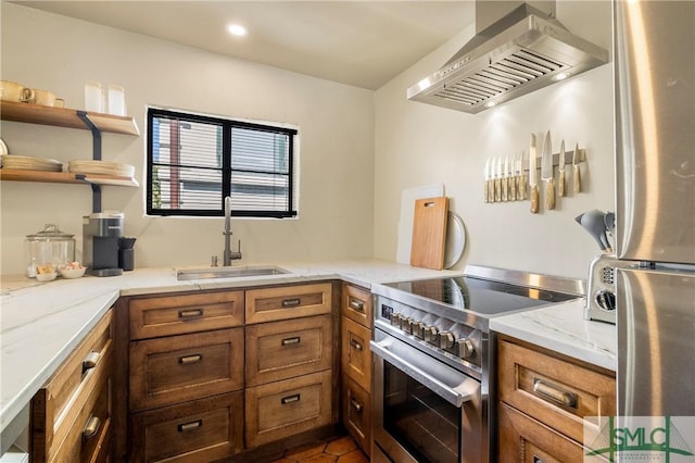 102 E 38th St, Savannah, GA 31401 - kitchen featuring wall chimney exhaust hood, appliances with stainless steel finishes, a sink, brown cabinetry, and recessed lighting